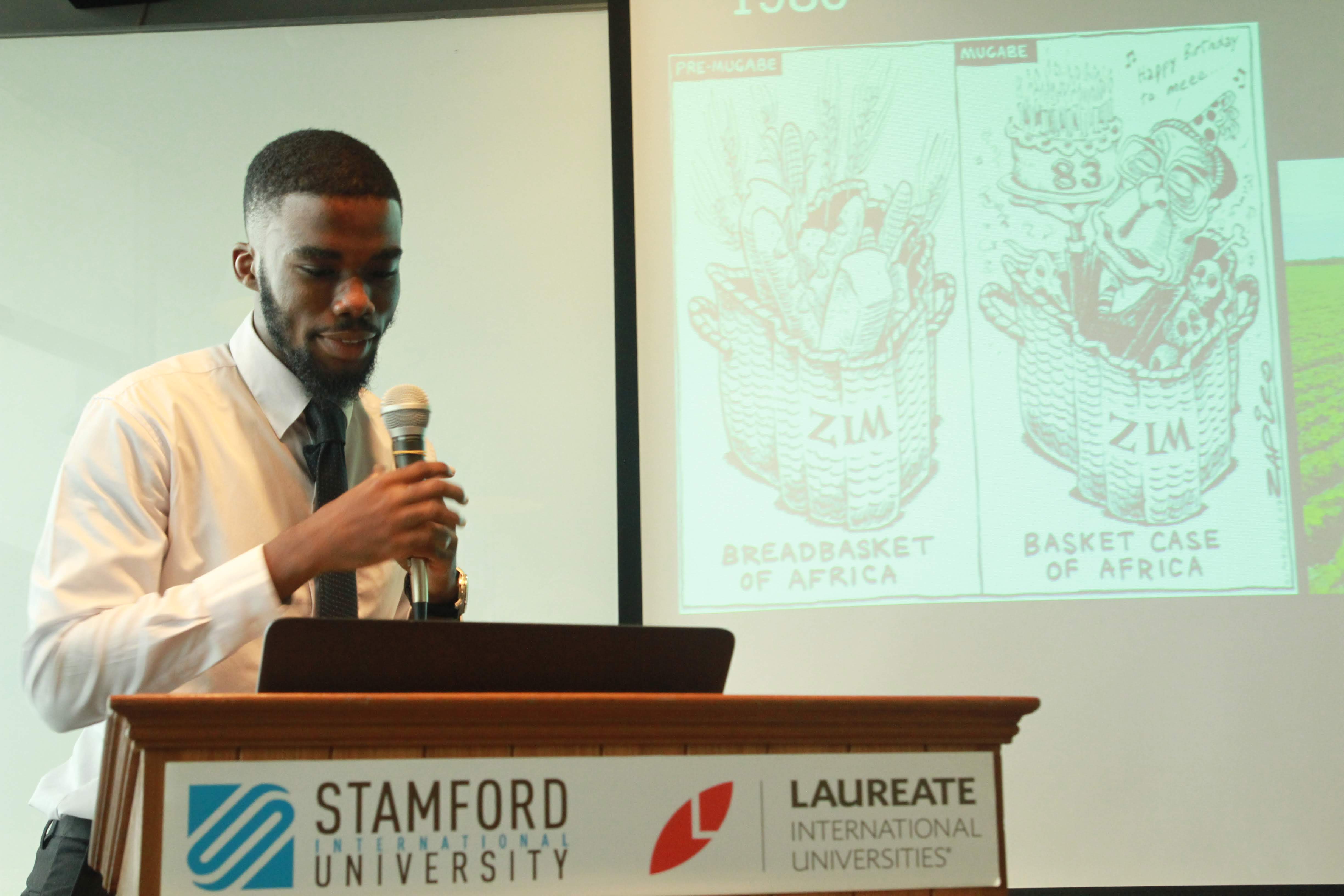 Russell presenting at a university podium