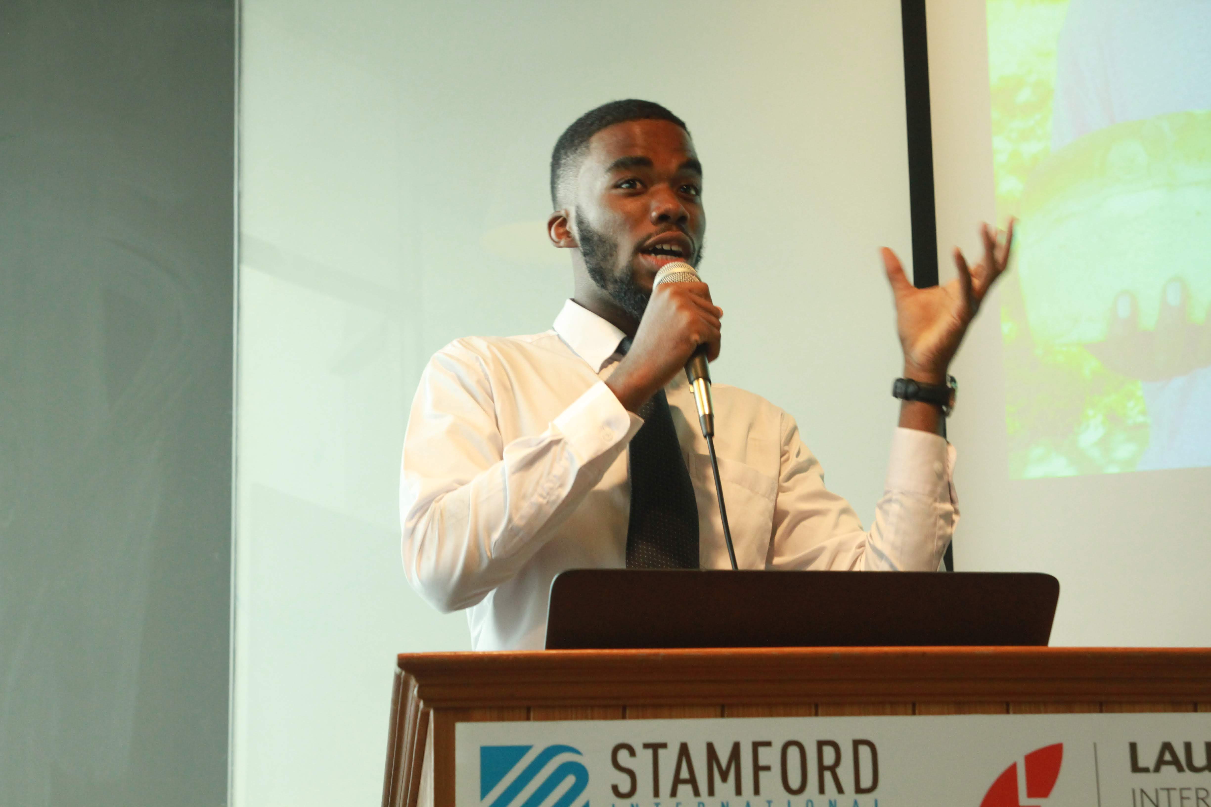 Russell practicing public speaking at university