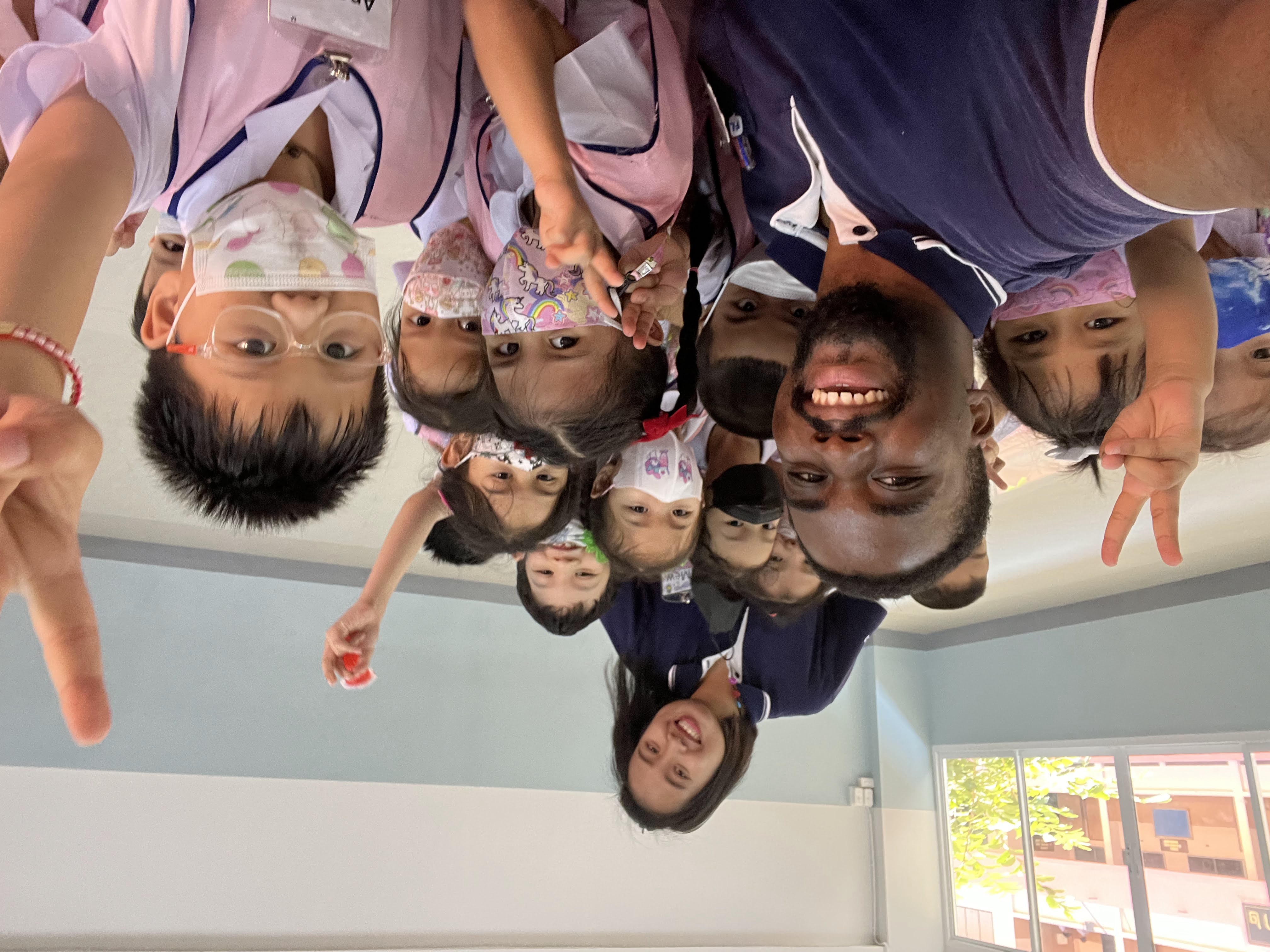 Russell and his young students sharing a classroom moment